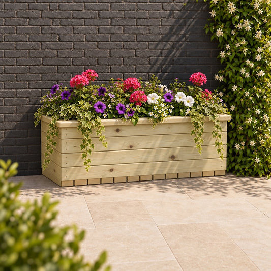 1m Deluxe Large Wooden Trough Planter planted in a garden setting